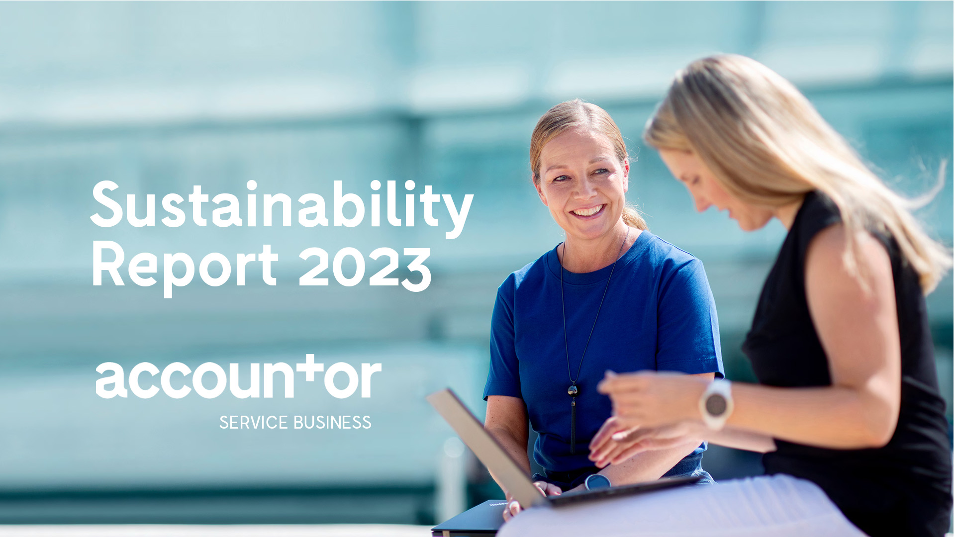 two women sitting outdoors