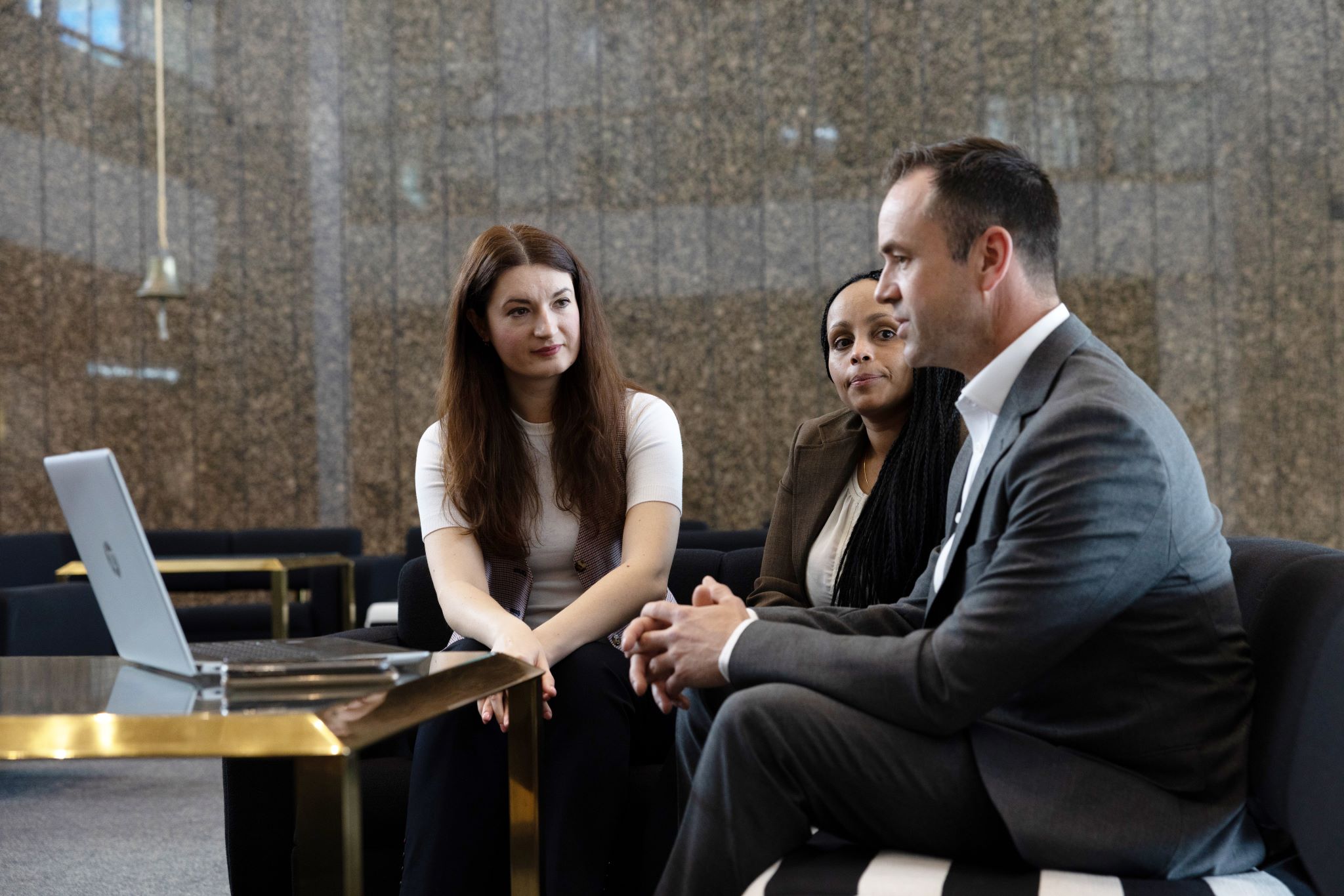 Two ladies and a man